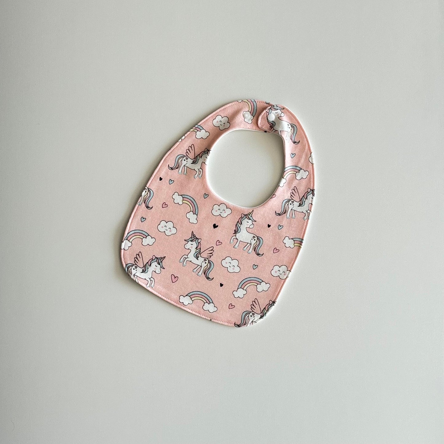 Shimmering unicorn feeding bibs