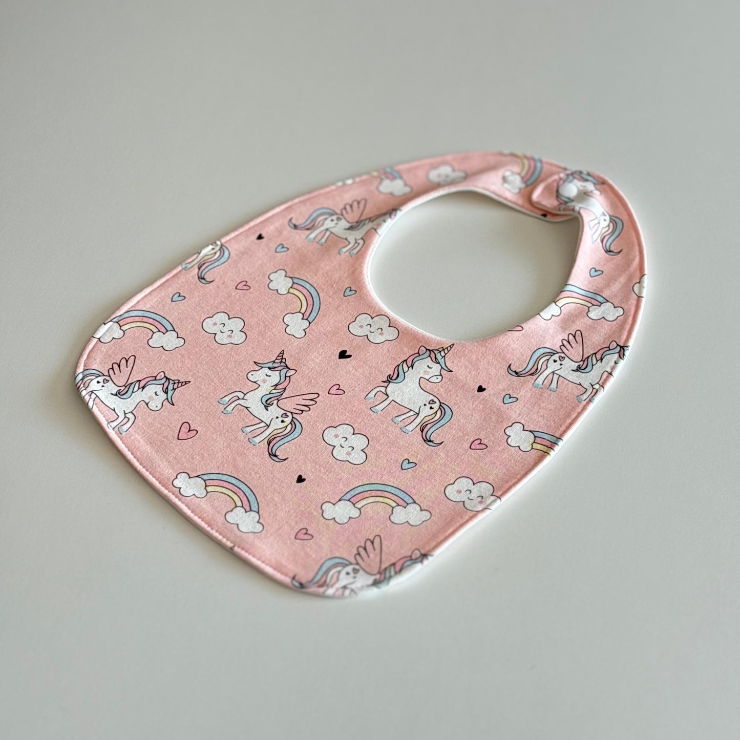 Shimmering unicorn feeding bibs